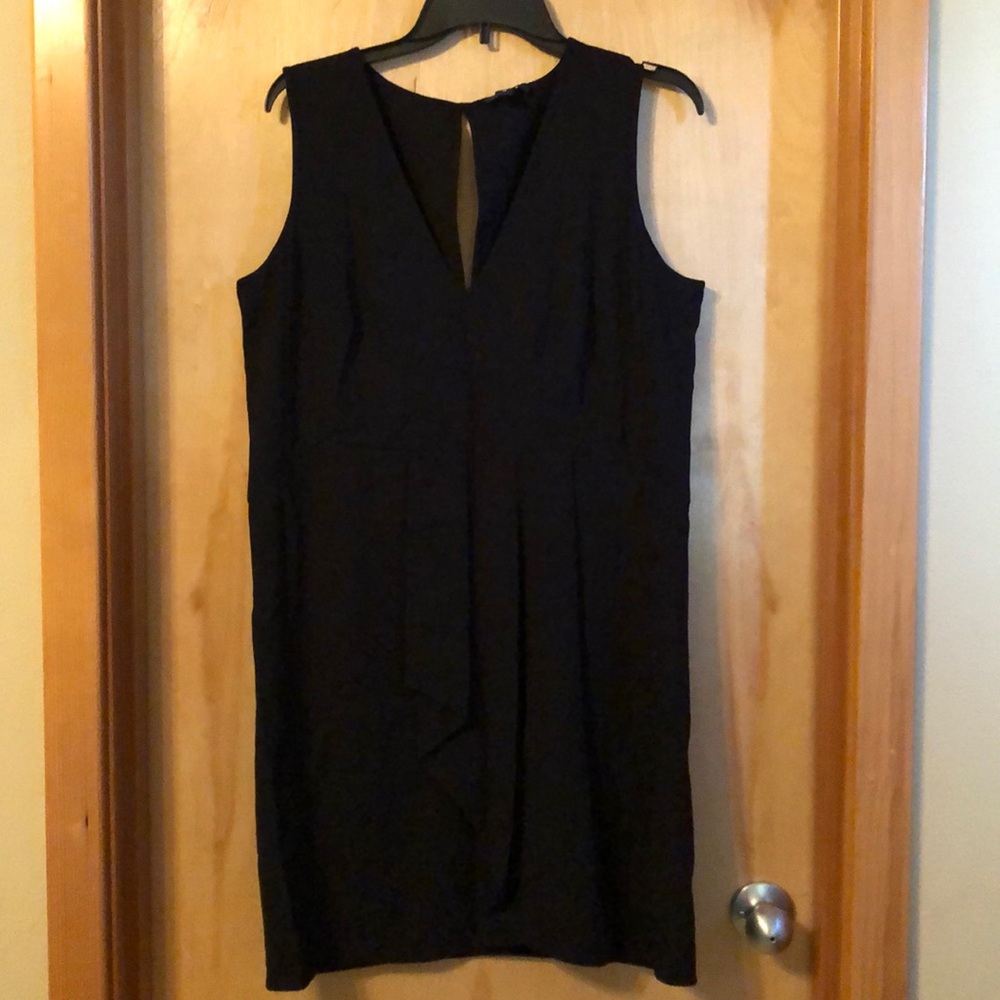 Black sleeveless, v neck. Polyester and rayon